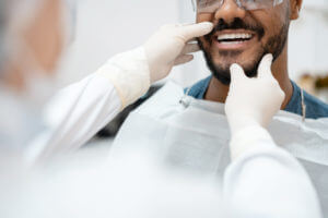 Man after teeth whitening procedure