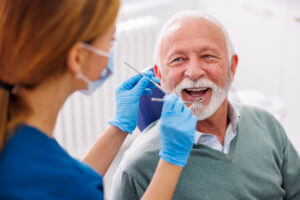 Doctor checking up patient at dentist office