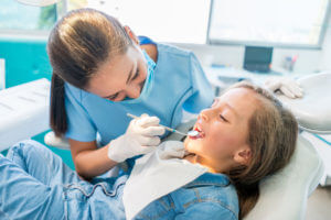 Beautiful girl at the dentist for orthodontic treatment