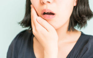 Patient with toothache caused by gum disease.